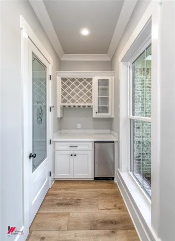 a bathroom with a granite countertop sink a large mirror and a bathtub