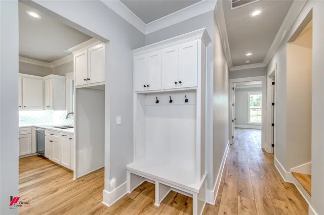 a view of a kitchen with wooden floor