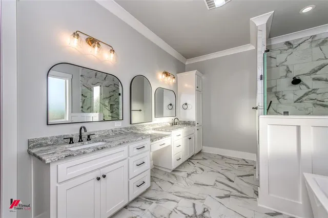a spacious bathroom with a granite countertop sink a toilet and a mirror