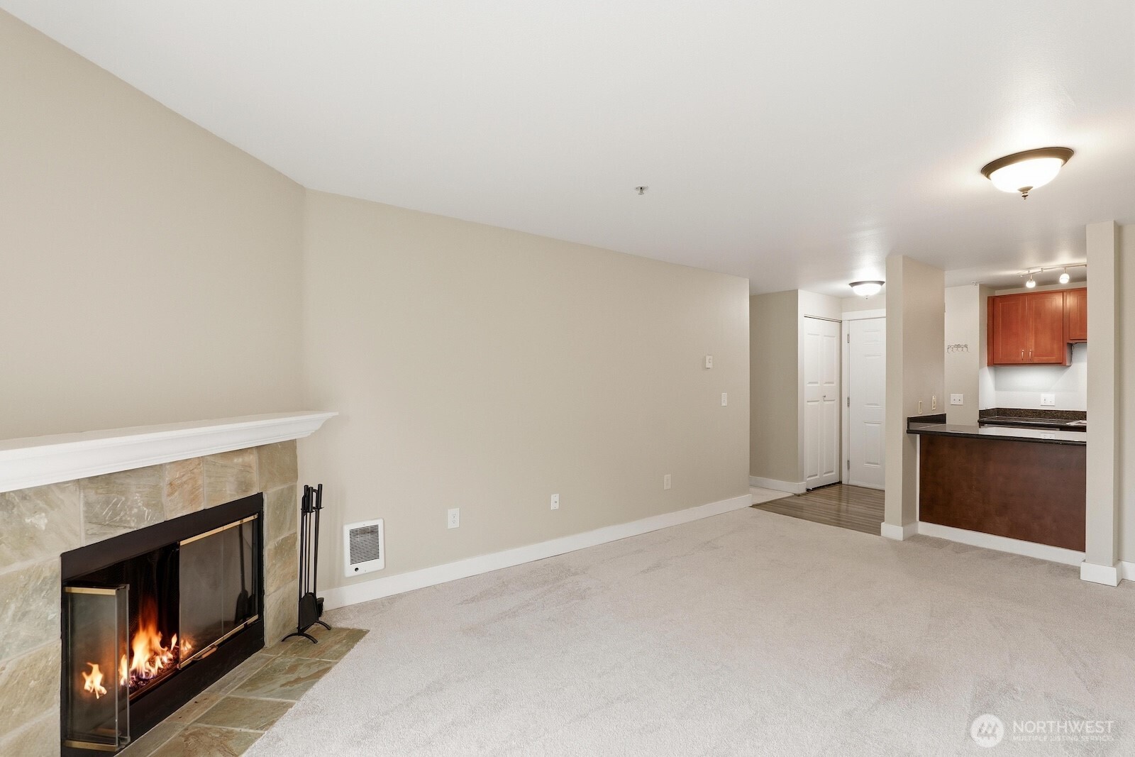 16409 Currie Road Southeast, Unit A308 Monroe, WA 98272 - Photo 7 of 21 a view of an empty room with a fireplace