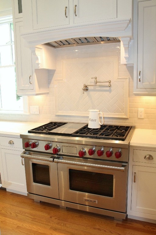 6 Chadbourne Road Lexington, MA 02421 - Photo 12 of 30 a stove top oven sitting inside of a kitchen