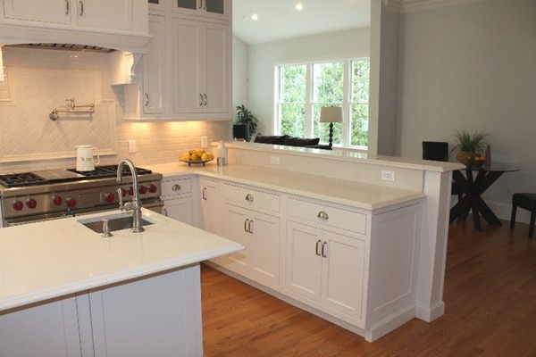6 Chadbourne Road Lexington, MA 02421 - Photo 15 of 30 a kitchen with a sink a stove and white cabinets