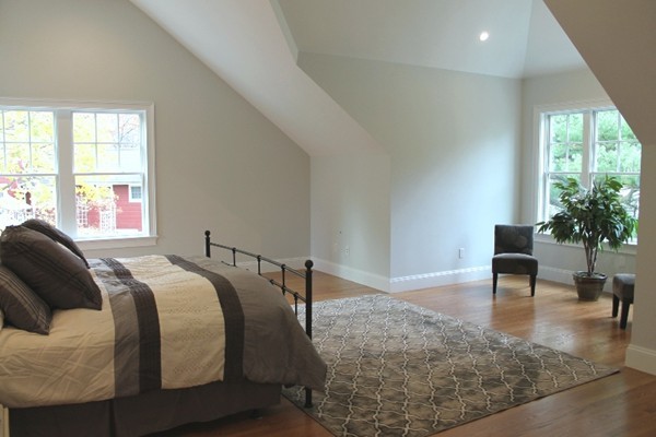 6 Chadbourne Road Lexington, MA 02421 - Photo 18 of 30 a bed sitting in a bedroom next to a window
