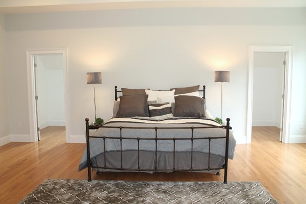 6 Chadbourne Road Lexington, MA 02421 - Photo 20 of 30 a bedroom with a bed and wooden floor