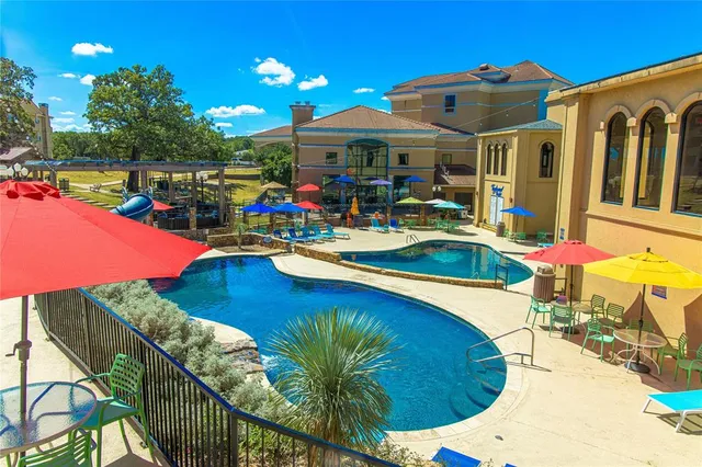 a view of a swimming pool with a patio
