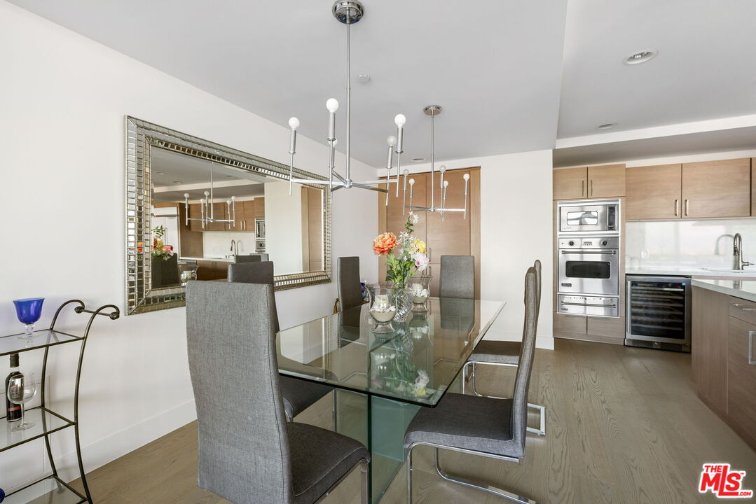 13650 Marina Pointe Drive, Unit 1806 Marina del Rey, CA 90292 - Photo 20 of 65 a view of a dining room with furniture