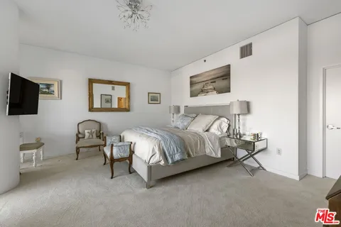 a spacious bathroom with a tub and shower