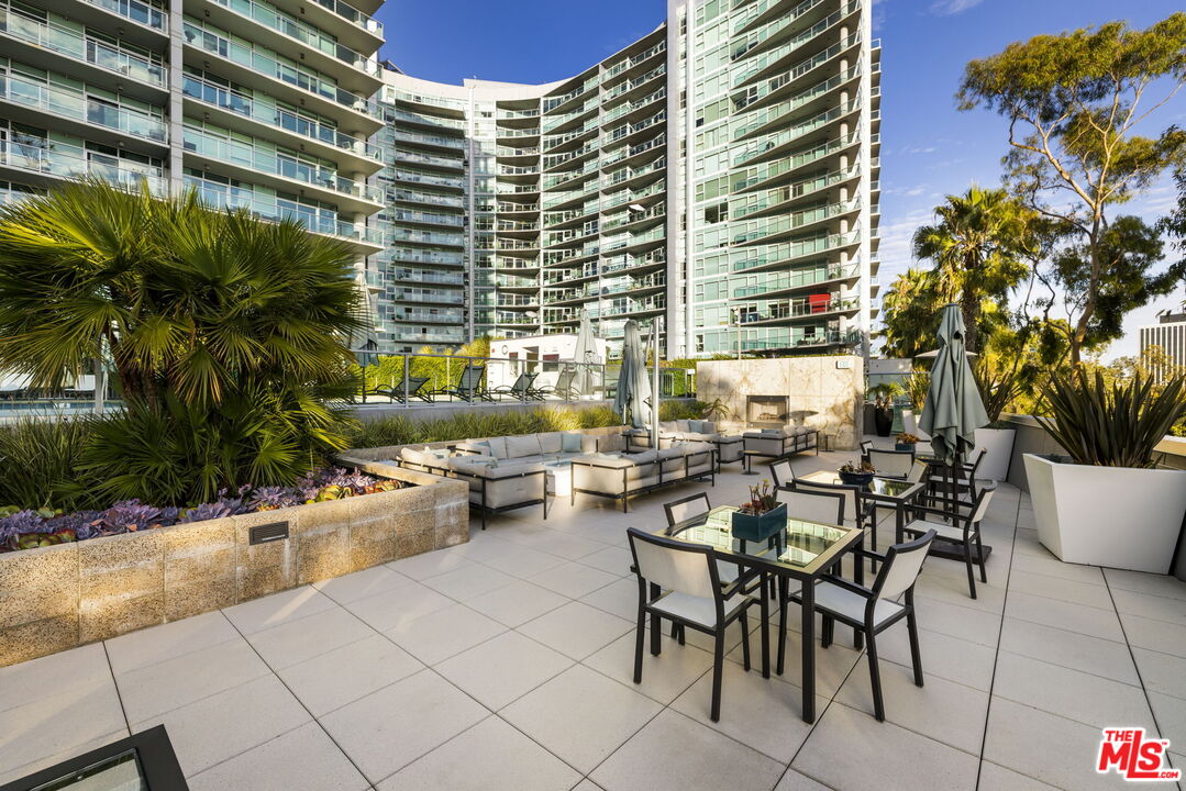 13650 Marina Pointe Drive, Unit 1806 Marina del Rey, CA 90292 - Photo 53 of 65 a view of dinning table and chairs in patio