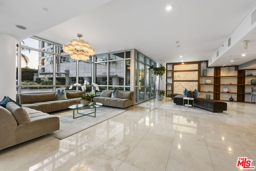 13650 Marina Pointe Drive, Unit 1806 Marina del Rey, CA 90292 - Photo 54 of 65 a living room with furniture and a flat screen tv