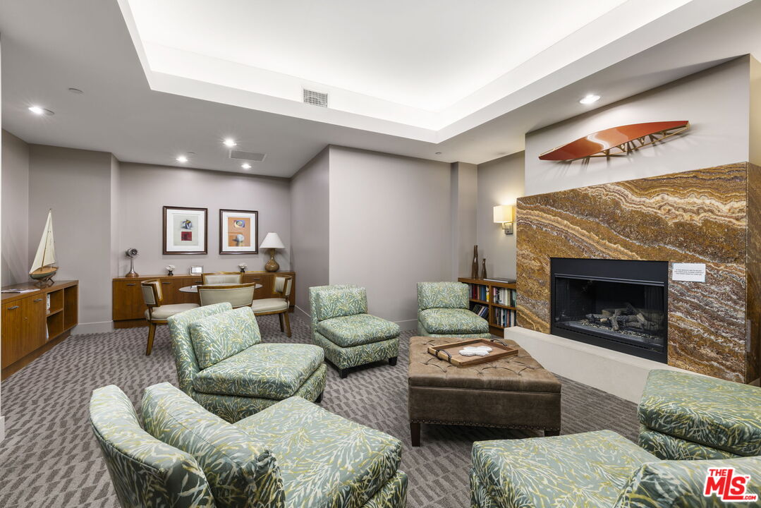 13650 Marina Pointe Drive, Unit 1806 Marina del Rey, CA 90292 - Photo 60 of 65 a living room with furniture and a fireplace