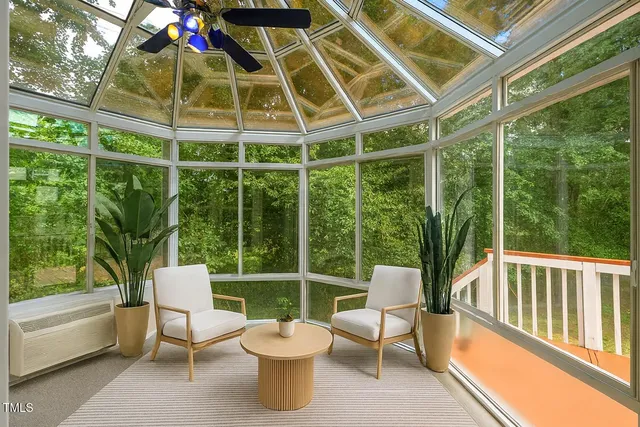 a view of a chairs and table in a balcony
