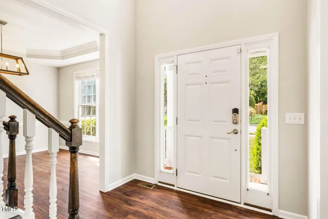 a view of an entryway with wooden floor