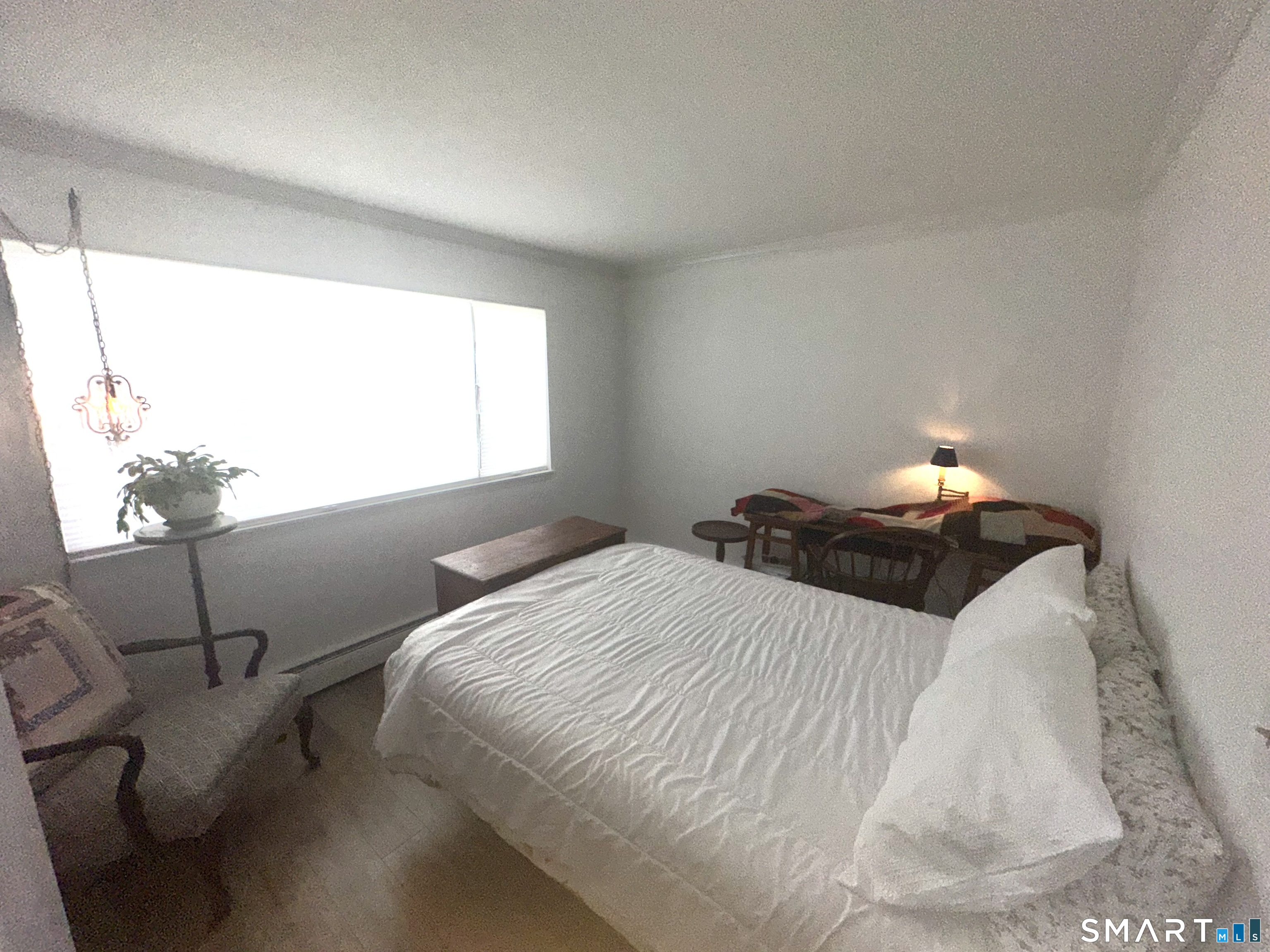 126 Sherman Hill Road, Unit C14 Woodbury, CT 06798 - Photo 12 of 27 a bedroom with a bed and window