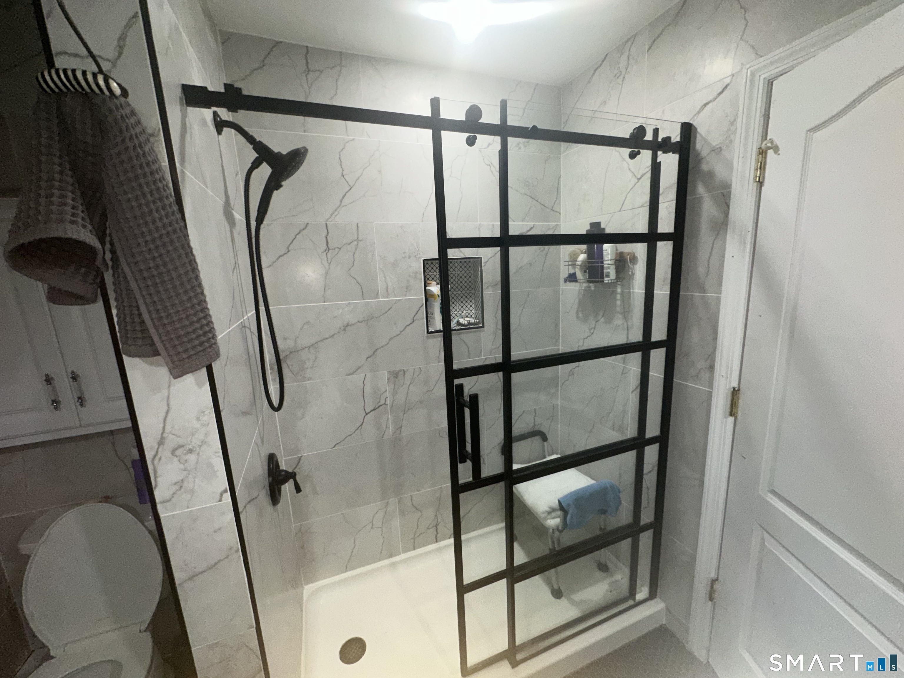 126 Sherman Hill Road, Unit C14 Woodbury, CT 06798 - Photo 13 of 27 a bathroom with a shower