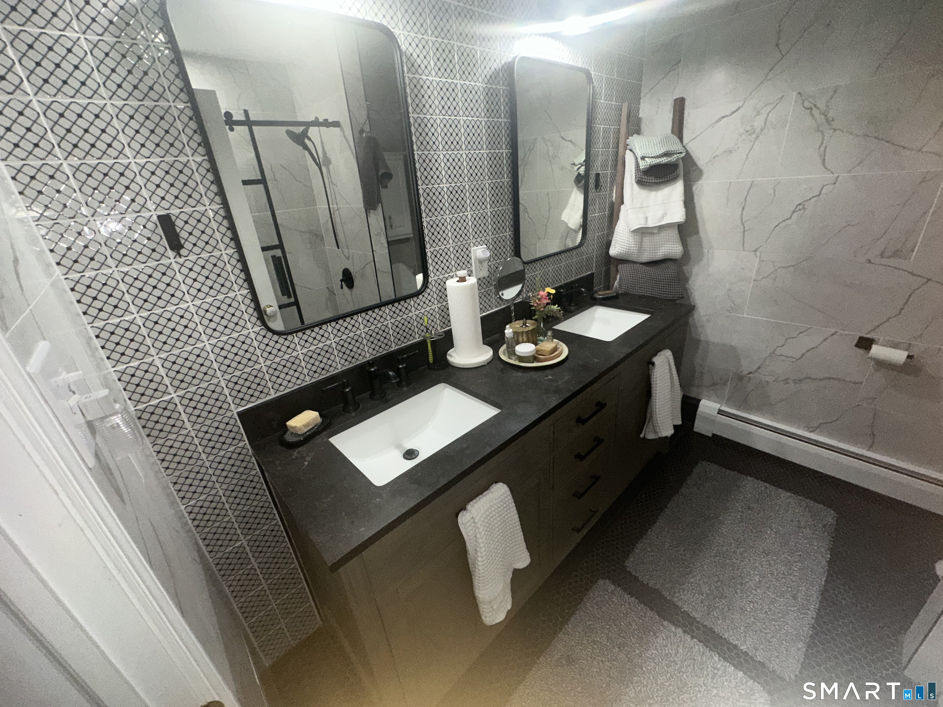 126 Sherman Hill Road, Unit C14 Woodbury, CT 06798 - Photo 14 of 27 a bathroom with a sink vanity and mirror