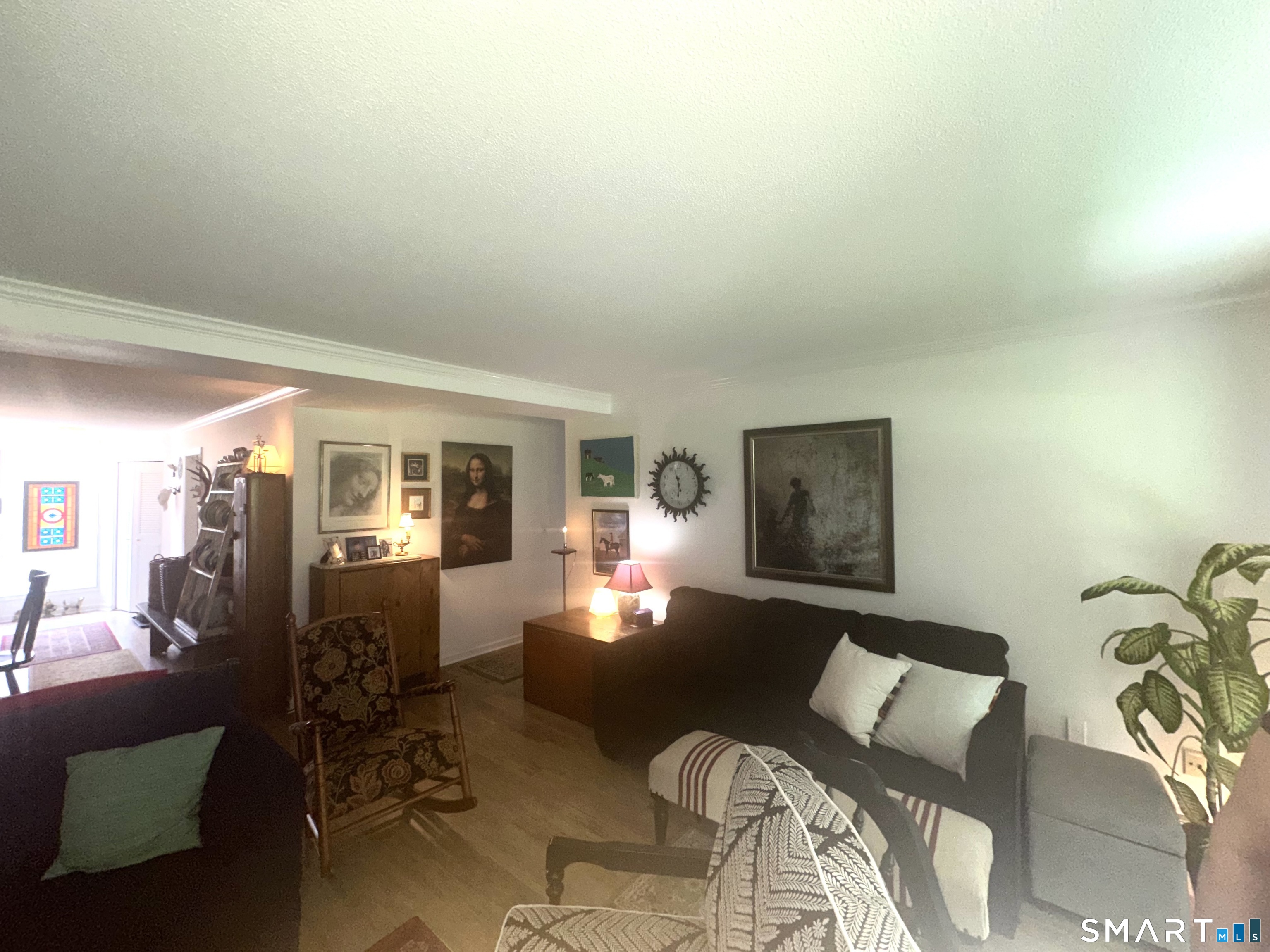 126 Sherman Hill Road, Unit C14 Woodbury, CT 06798 - Photo 20 of 27 a living room with furniture and a lamp
