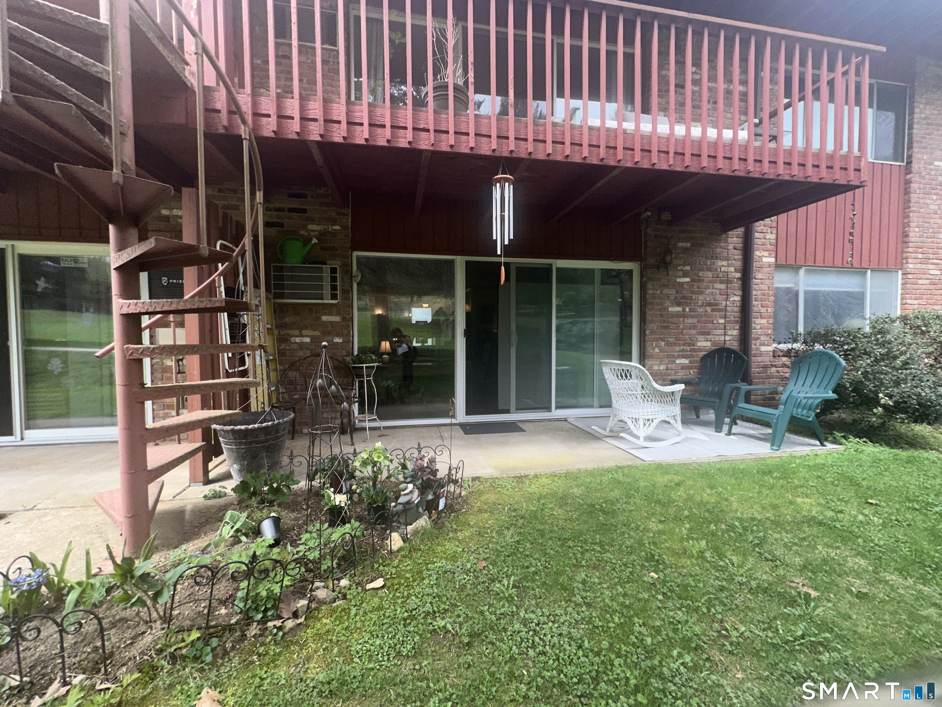 126 Sherman Hill Road, Unit C14 Woodbury, CT 06798 - Photo 27 of 27 a view of a house with backyard porch and sitting area