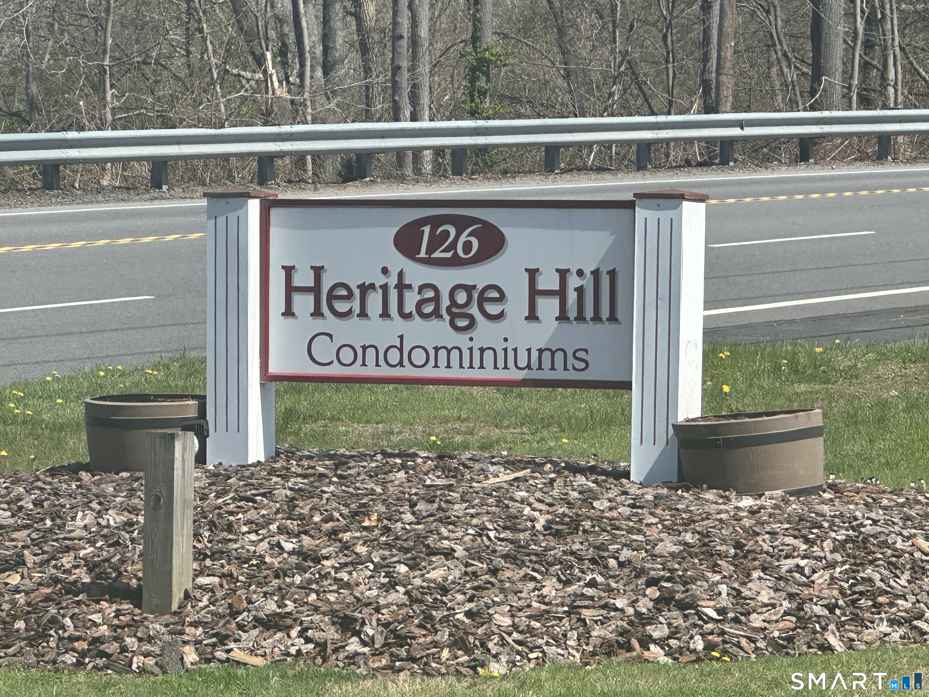 126 Sherman Hill Road, Unit C14 Woodbury, CT 06798 - Photo 3 of 27 a sign on the side of a building