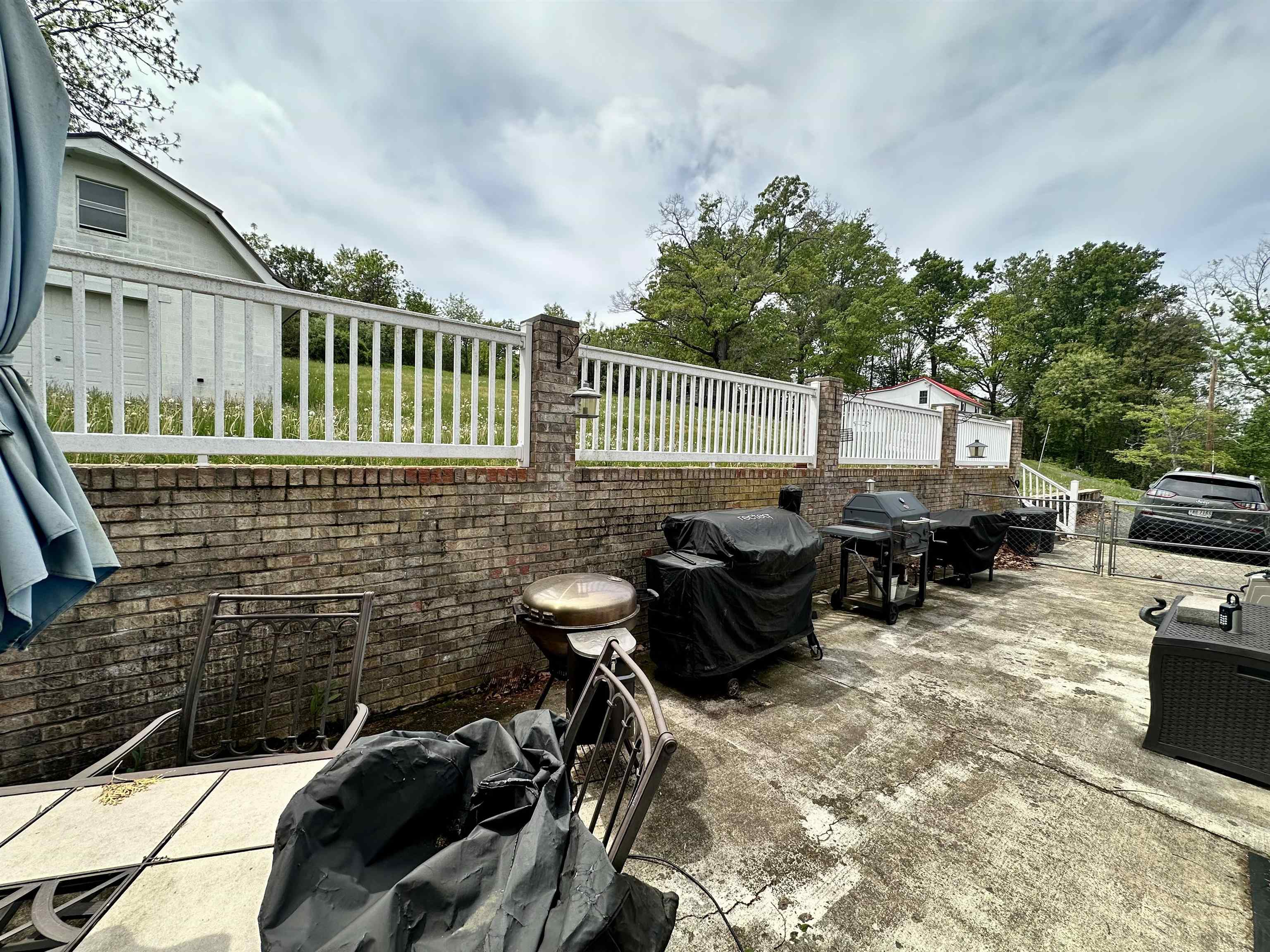 661 Ladd Road Fishersville, VA 22939 - Photo 13 of 14 a backyard of a house with table and chairs