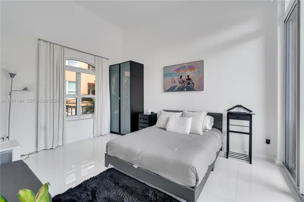 a bedroom with a bed and a table