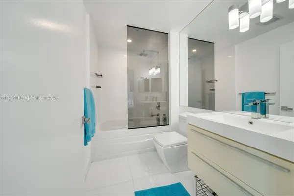 a view of bathroom with dual sinks