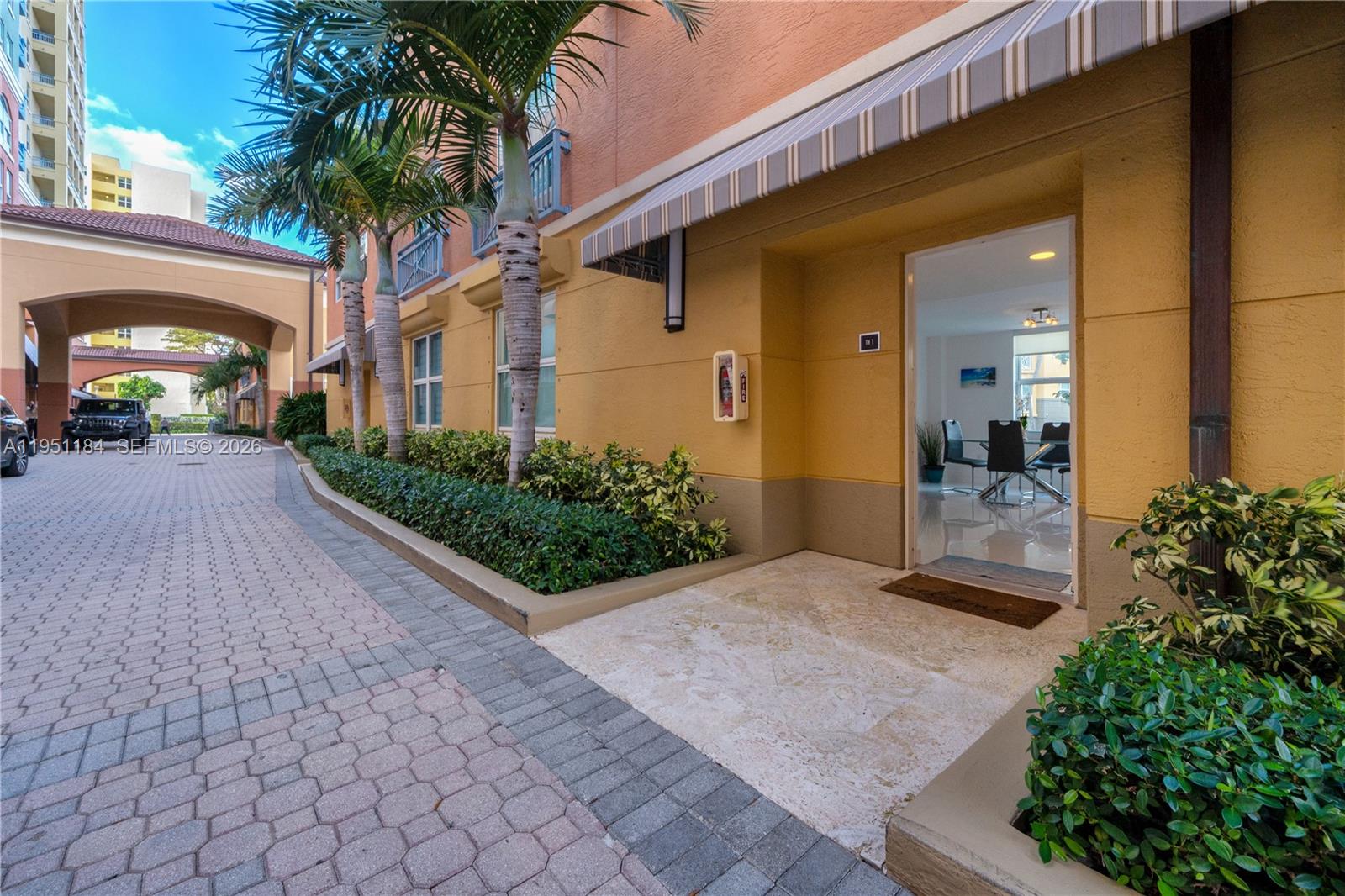 90 Alton Road, Unit TH1 Miami Beach, FL 33139 - Photo 23 of 48 a view of a house with a patio