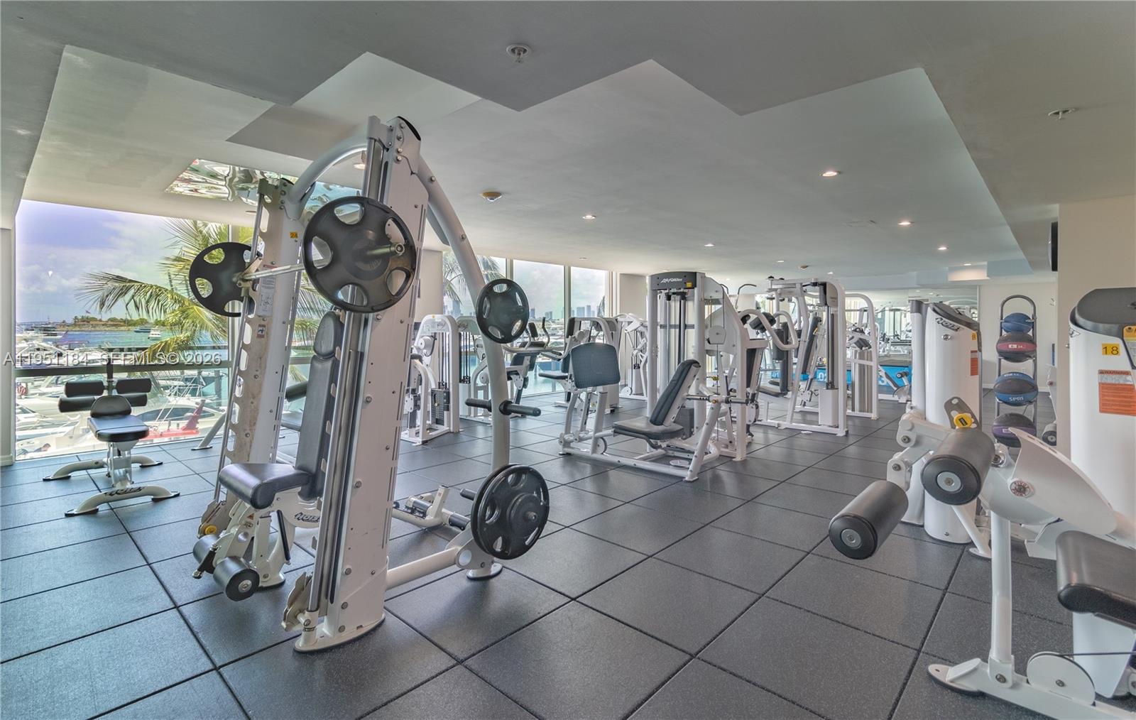 90 Alton Road, Unit TH1 Miami Beach, FL 33139 - Photo 40 of 48 a view of a room with gym equipment