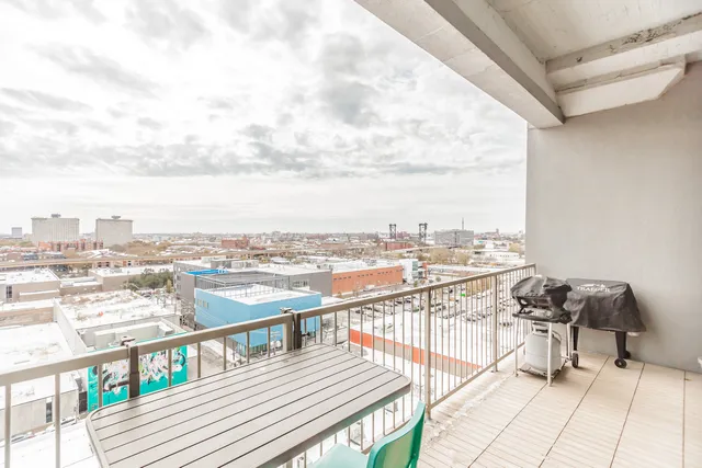 a bathroom with a granite countertop bathtub sink vanity mirror and toilet