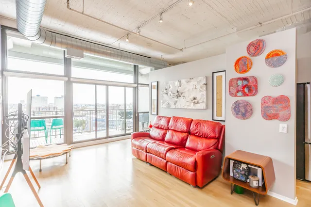 a kitchen with granite countertop a sink stove and refrigerator