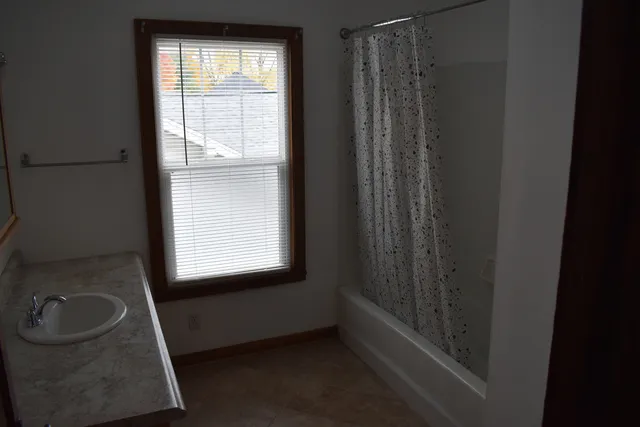 a white toilet sitting next to a bathroom sink