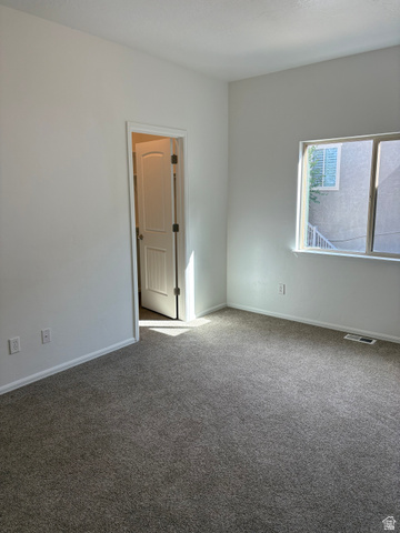 3365 Falcon Way Layton, UT 84040 - Photo 12 of 27 Neutral-toned wall-to-wall carpeting complements the white walls and trim
