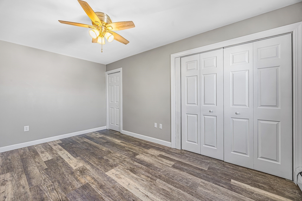 82 Mitchell Drive, Unit 82 Chicopee, MA 01022 - Photo 19 of 31 wooden floor in an empty room