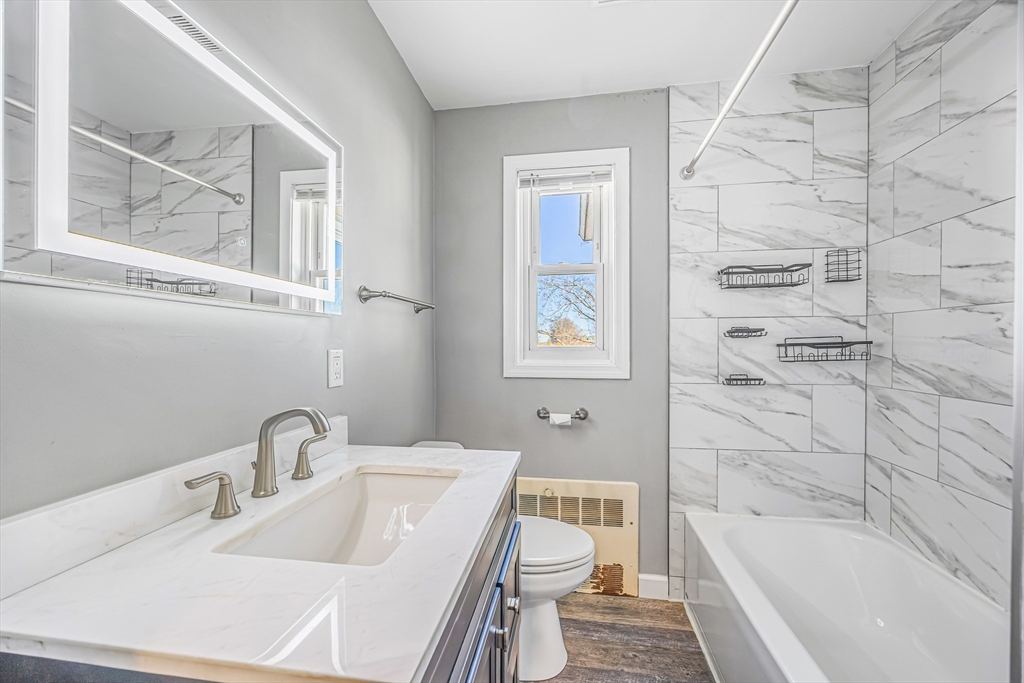 82 Mitchell Drive, Unit 82 Chicopee, MA 01022 - Photo 20 of 31 a bathroom with a sink toilet and shower