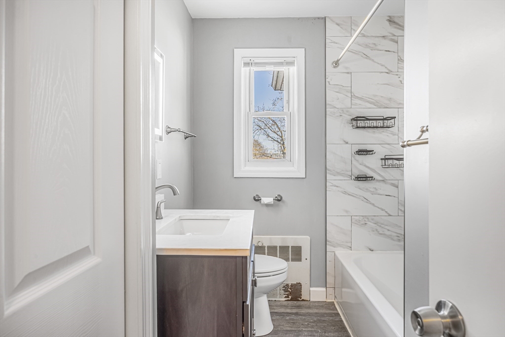 82 Mitchell Drive, Unit 82 Chicopee, MA 01022 - Photo 21 of 31 a bathroom with a sink a toilet and shower