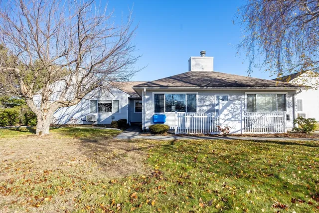 a view of a house with swimming pool and sitting area