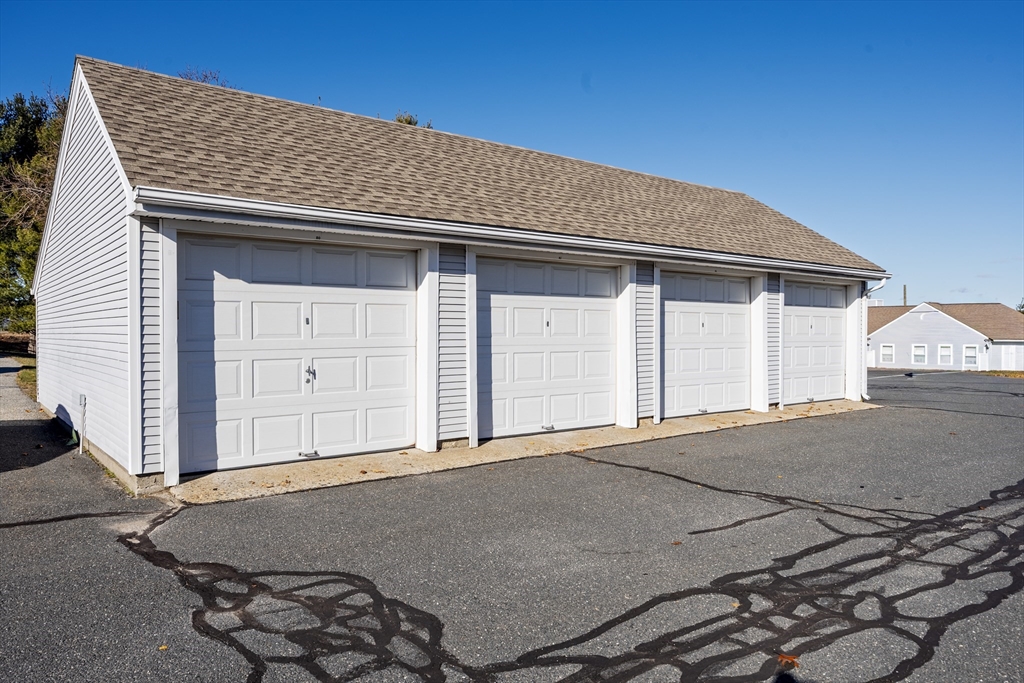 82 Mitchell Drive, Unit 82 Chicopee, MA 01022 - Photo 27 of 31 a backyard of a house