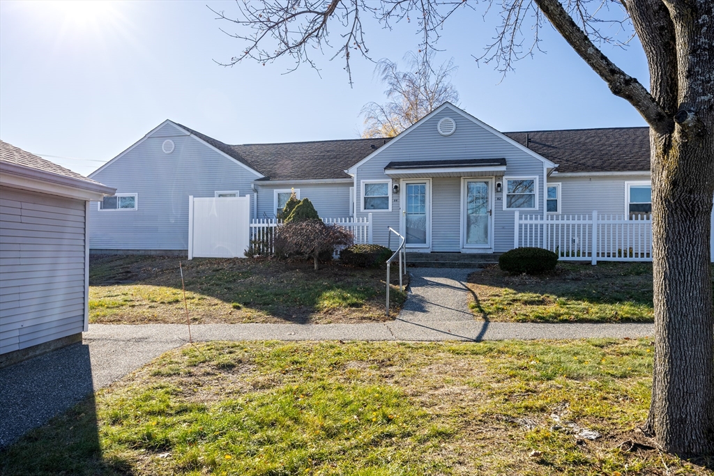 82 Mitchell Drive, Unit 82 Chicopee, MA 01022 - Photo 28 of 31 a front view of a house with a yard