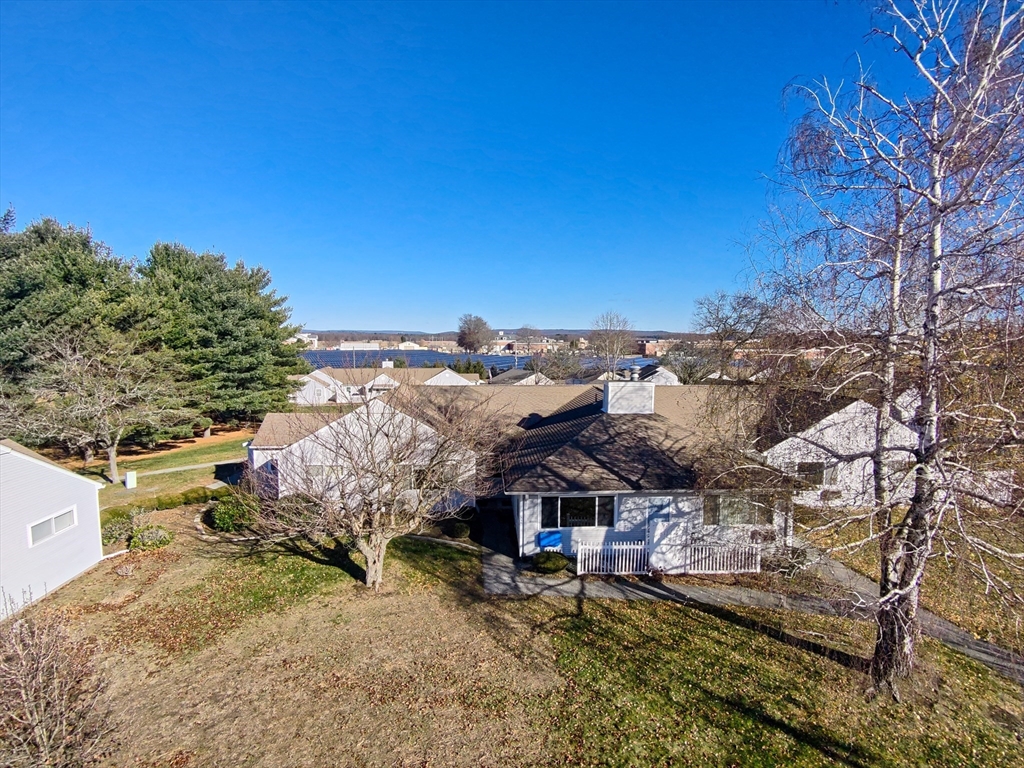 82 Mitchell Drive, Unit 82 Chicopee, MA 01022 - Photo 3 of 31 a view of a house with a yard
