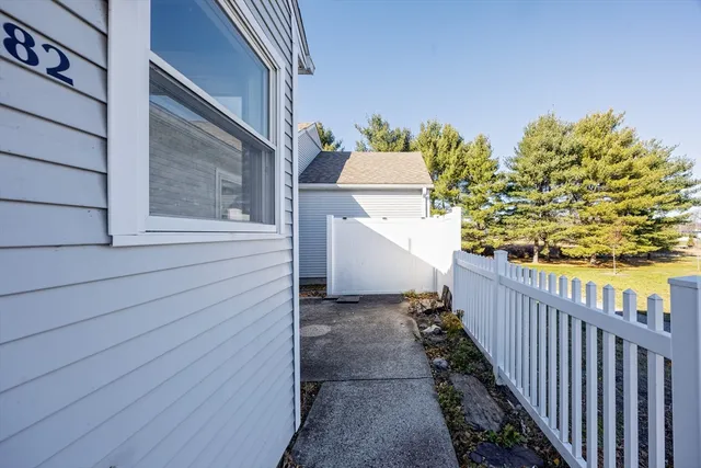 a view of a balcony with wooden floor and fence