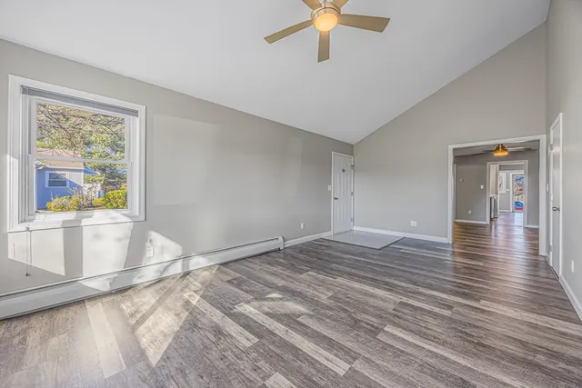 wooden floor in an empty room with a window