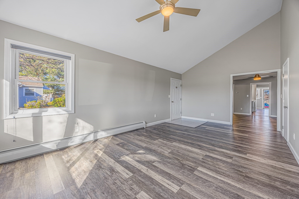 82 Mitchell Drive, Unit 82 Chicopee, MA 01022 - Photo 9 of 31 wooden floor in an empty room with a window