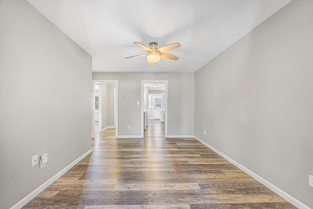 82 Mitchell Drive, Unit 82 Chicopee, MA 01022 - Photo 10 of 31 a view of an empty room with window and wooden floor