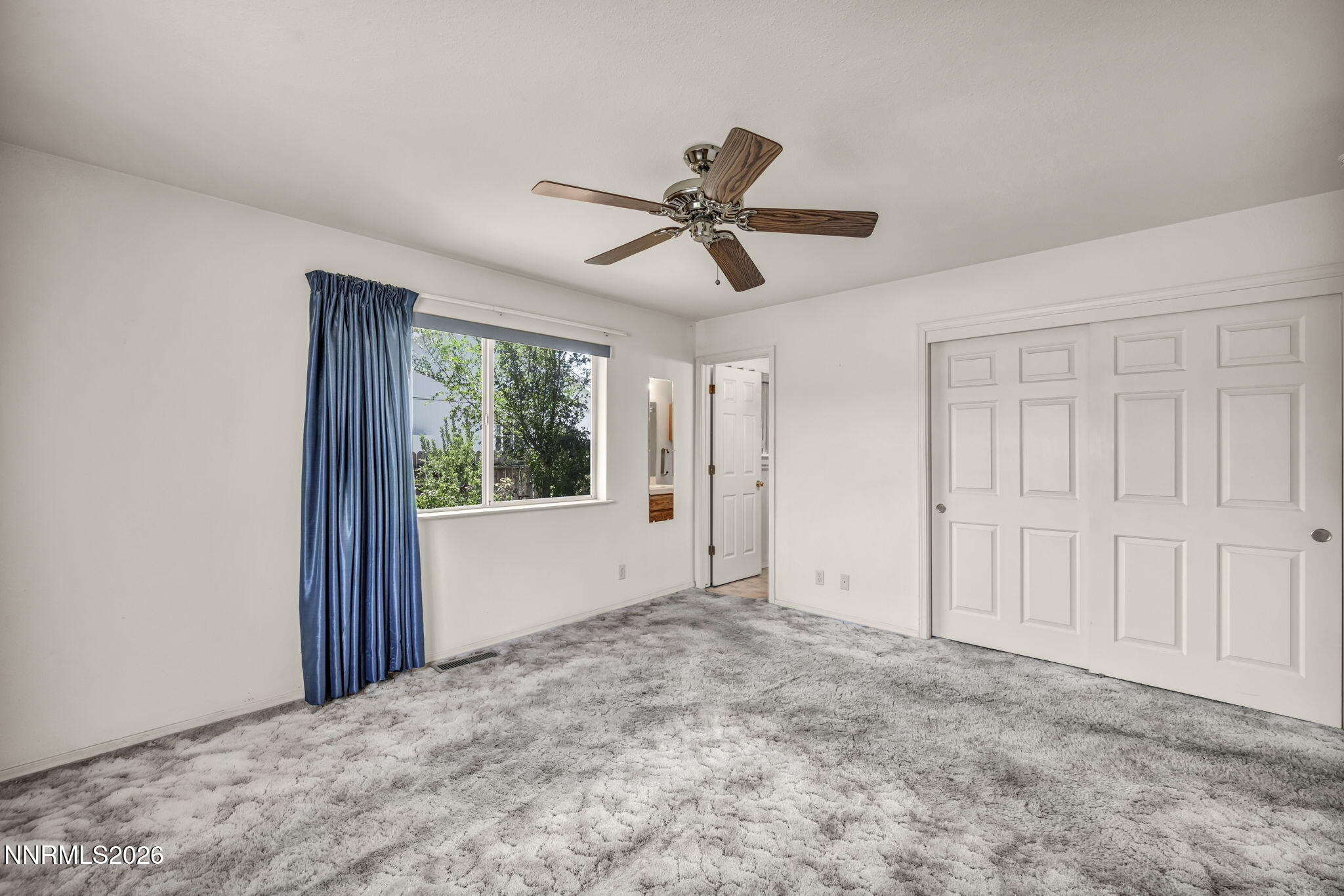 692 Lassen Way Gardnerville, NV 89460 - Photo 16 of 34 a view of a livingroom with a ceiling fan and window