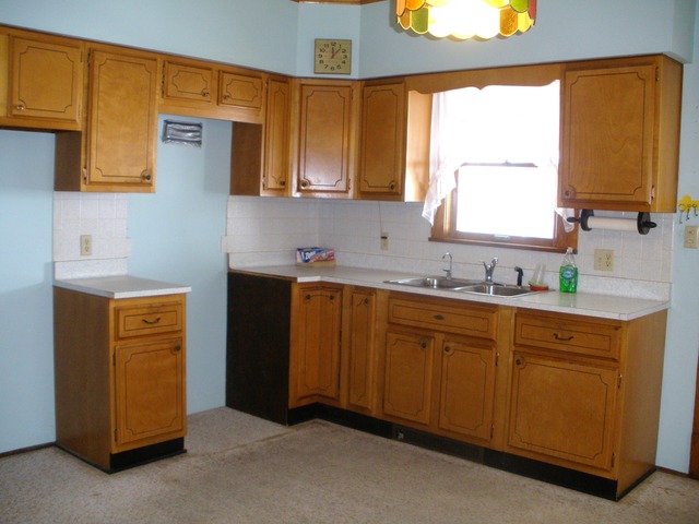 4794 East 5th Road Mendota, IL 61342 - Photo 7 of 10 a kitchen with stainless steel appliances sink cabinets and window