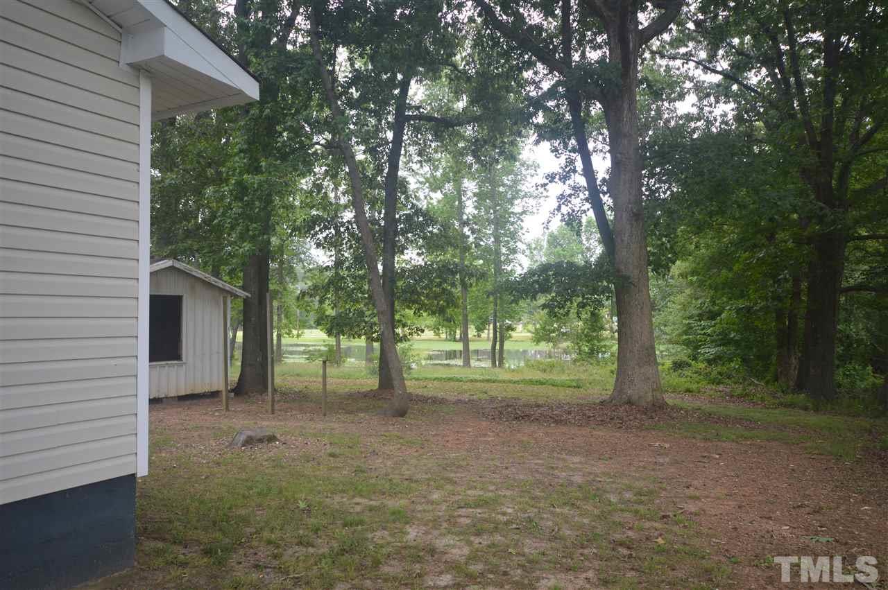 329 Clinton Carlyle Road Zebulon, NC 27597 - Photo 21 of 24 a view of a yard with tree s