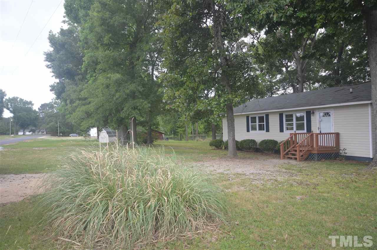 329 Clinton Carlyle Road Zebulon, NC 27597 - Photo 4 of 24 a view of a house with a yard