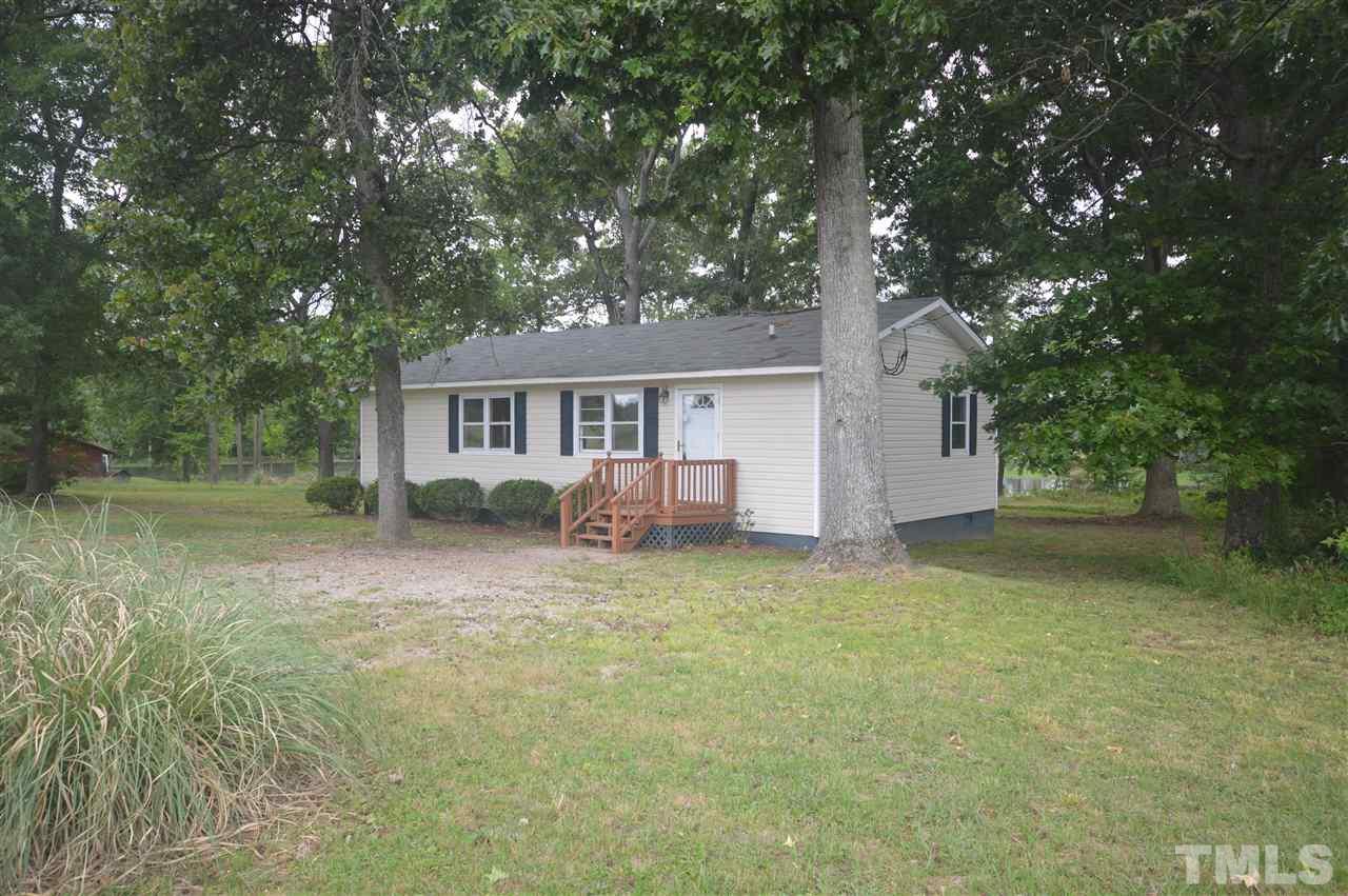329 Clinton Carlyle Road Zebulon, NC 27597 - Photo 8 of 24 a house view with a outdoor space