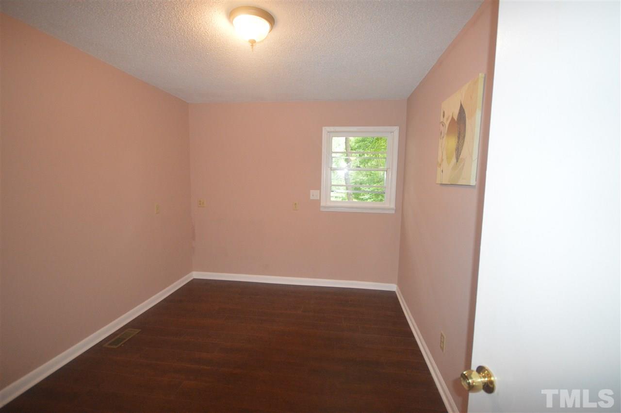 329 Clinton Carlyle Road Zebulon, NC 27597 - Photo 9 of 24 an empty room with windows