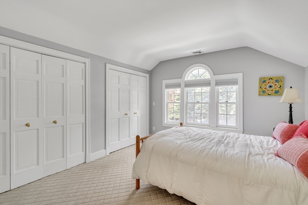 34 Solomon Pierce Road Lexington, MA 02420 - Photo 26 of 42 a spacious bedroom with a bed and a large window