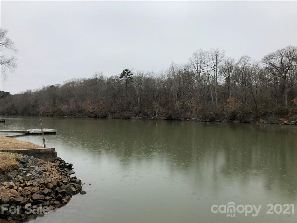 1420 Riverside Drive Charlotte, NC 28214 - Photo 2 of 13 a view of a lake with a mountain in the background